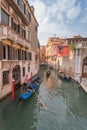 Beautiful Canal in Venice and gondolier