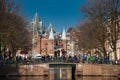 The beautiful canals of Amsterdam, the bicycles and the Waag a 15th-century building located at Nieuwmarkt square