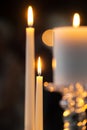 Beautiful candle light wax candles lit in stunning wedding ceremony venue