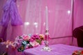 White decorative candles pink backgrounds . Beautiful candle on pink background . Candle in candlestick burning . Retro Candelabra Royalty Free Stock Photo