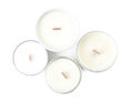 Beautiful candles with wooden wicks on white background, top view Royalty Free Stock Photo