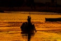 Canoe crossing at sunset in Guarda do Embau Beach - Santa Catarina Brazil