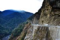 The beautiful canyon and the narrow dangerous mountain road in beautiful Himalayas mountains with steep slopes in Bhutan