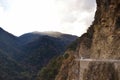 The beautiful canyon and the narrow dangerous mountain road in beautiful Himalayas mountains with steep slopes in Bhutan