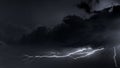 Beautiful capture of a lightning tearing apart the night sky Royalty Free Stock Photo