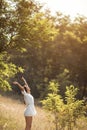 Beautiful carefree woman in fields being happy outdoors Royalty Free Stock Photo