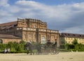 A beautiful carriage crosses the gardens.