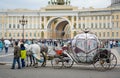 Beautiful carriage on Palace Square. People in carriage at Palace Square near Winter Palace of St. Petersburg. Summer 2016.