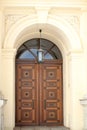 Beautiful, carved, large natural wood door with gypsum arch in Munich Royalty Free Stock Photo