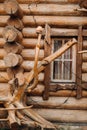 Beautiful carved wooden house in the village of logs and farmyards