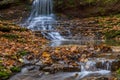 Colorful majestic waterfall in national park forest during autumn Royalty Free Stock Photo