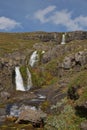 Beautiful cascade waterfall Bleiksarfoss in Eskifjordur, east of Iceland