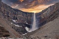 Beautiful cascades of scenic Hengifoss falling from mountains during sunset Royalty Free Stock Photo