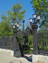 Beautiful cast-iron gates with lanterns and a lattice with decorations at the entrance to the Summer Garden of the city of Royalty Free Stock Photo