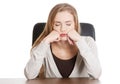 Beautiful casual, bored or sleeping student woman by a desk. Royalty Free Stock Photo