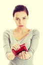 Beautiful casual woman showing her empty wallet. Royalty Free Stock Photo