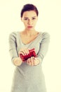 Beautiful casual woman showing her empty wallet. Royalty Free Stock Photo