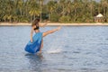 Beautiful caucasian brunette girl on the tropical beach in sea water, Thailand. Nature and summer concept Royalty Free Stock Photo