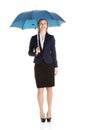 Beautiful caucasian business woman standing under umbrella. Royalty Free Stock Photo