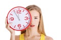 Beautiful caucasian casual woman holding red clock. Royalty Free Stock Photo