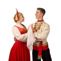 Beautiful caucasian cuple dancing in Russian folk costumes on white Royalty Free Stock Photo