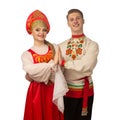 Beautiful caucasian cuple dancing in Russian folk costumes on white Royalty Free Stock Photo