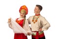 Beautiful caucasian cuple dancing in Russian folk costumes on white Royalty Free Stock Photo