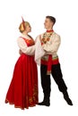 Beautiful caucasian cuple dancing in Russian folk costumes isolated on white Royalty Free Stock Photo