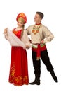 Beautiful caucasian cuple dancing in Russian folk costumes on white Royalty Free Stock Photo