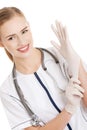 Beautiful caucasian doctor or nurse putting white sterile glove. Royalty Free Stock Photo