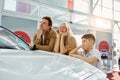 Beautiful caucasian family dream about new car together