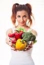 Beautiful caucasian girl holding glasses bowl with ingredients for low-caloric vegetables salad