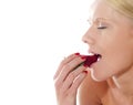 Beautiful caucasian lady tasting yummy strawberry Royalty Free Stock Photo