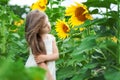Beautiful caucasian little girl in a field with sunflowers Royalty Free Stock Photo