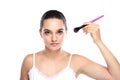 Beautiful caucasian model holding kabuki brush Royalty Free Stock Photo