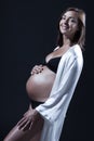 Beautiful caucasian pregnant woman in nightie