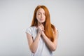 Beautiful Caucasian redhead woman praying at home Royalty Free Stock Photo