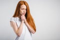 Beautiful Caucasian redhead woman praying at home Royalty Free Stock Photo