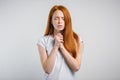 Beautiful Caucasian redhead woman praying at home Royalty Free Stock Photo
