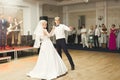 Beautiful caucasian wedding couple just married and dancing their first dance