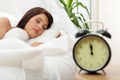 Beautiful Caucasian woman and alarmclock Royalty Free Stock Photo