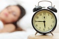 Beautiful Caucasian woman and alarmclock Royalty Free Stock Photo