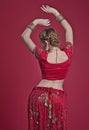 Beautiful caucasian woman with braided hair dressed in Indian bridal Sari along with specific jewelry