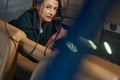 Seriously female mechanic working in salon of aircraft Royalty Free Stock Photo