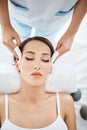 Beautiful caucasian woman enjoying facial spa procedure in salon Royalty Free Stock Photo