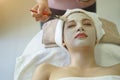 Beautiful caucasian woman having mask, lying on spa. Facial treatment in Spa salon Royalty Free Stock Photo