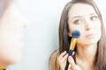 Beautiful caucasian woman or makeup artist doing make up yourself Royalty Free Stock Photo