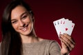 Beautiful caucasian woman with poker cards gambling in casino Royalty Free Stock Photo