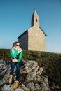 Beautiful caucasian woman is sitting in front of the church Royalty Free Stock Photo