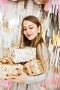 Beautiful Caucasian woman smiles with Christmas presen Royalty Free Stock Photo